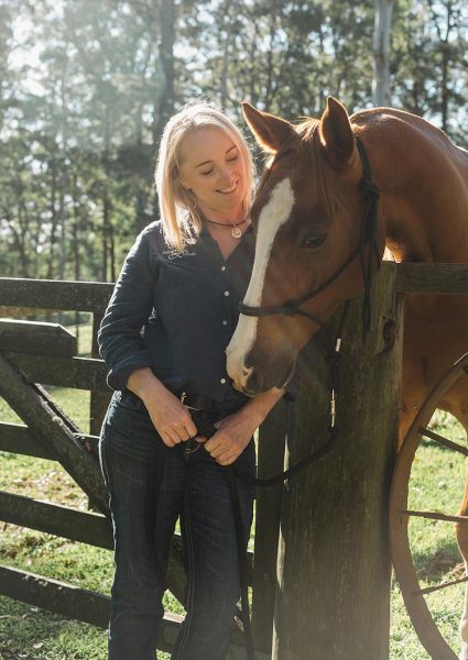 Dee with horse in paddock